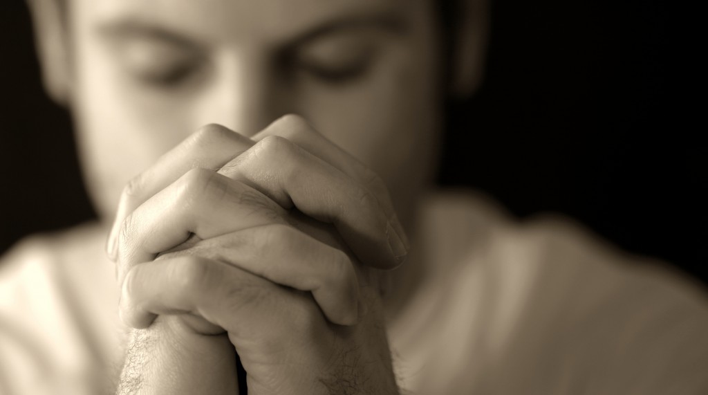 ManPrayingBW